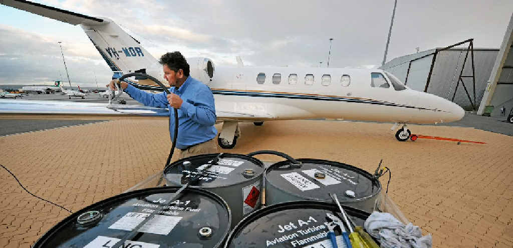 Linc Energy CEO and managing director Peter Bond refuels his jet with the new fuel. Linc Energy CEO and managing director Peter Bond refuels his jet with the new fuel.